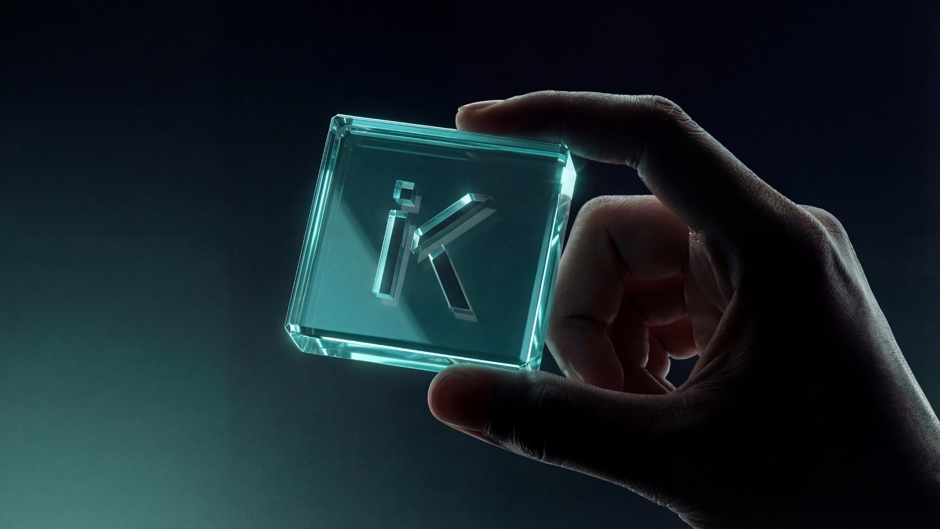 A hand holding a glowing translucent glass block etched with the iKeep logo